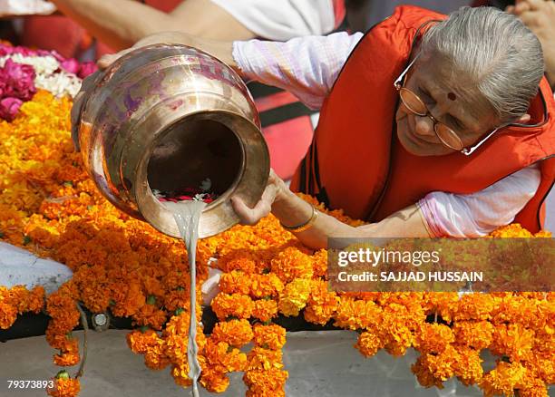 The great-granddaughter of Indian freedom icon Mahatama Gandhi, Nilamben Parikh immerses ashes into the Arabian sea in Mumbai, 30 January 2008. A...