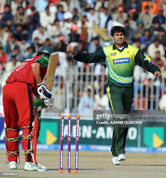 Pakistani bowler Sohail Khan celebrates after taking the wicket of Zimbabwean cricketer Ray Price during the fourth One-Day International cricket...