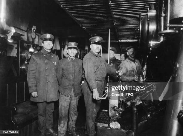 New York policemen operate the Staten Island Ferry during a strike by ferry drivers, circa 1925.