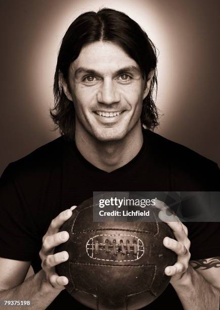 Italian footballer Paolo Maldini, son of Cesare Maldini, who plays as centre back for AC Milan and his national side, holding an old fashioned...