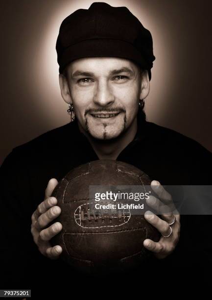 Italian footballer Roberto Baggio, striker for Brescia and the Italian national team, holding an old fashioned leather football, 5th December 2003. .