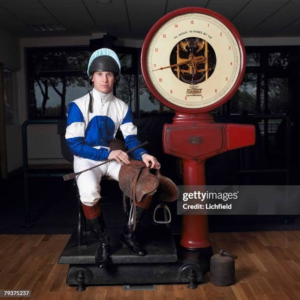 British jockey Richard Johnson in the Weighing Room at Haydock Park Racecourse, near Manchester on 6th May 2004. .