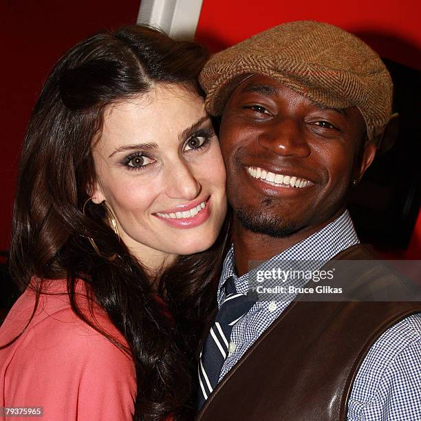 Singer/Actress Idina Menzel poses with husband Actor Taye Diggs as she promotes and performs from her New Warner Brothers CD "I Stand" at The Virgin...
