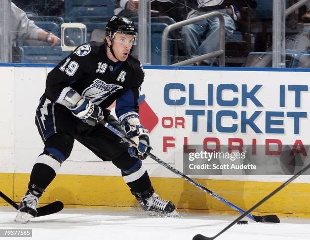 Brad Richards of the Tampa Bay Lightning controls the puck along the boards against the Buffalo Sabres at St. Pete Times Forum on January 29, 2008 in...