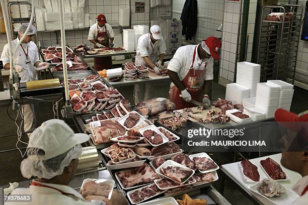 Employees prepare pieces of beef at a supermarket, in Sao Paulo, Brazil, 30 May 2007. The European Commission announced 30 January, 2008 that the...