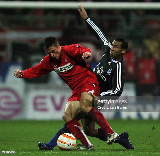 Jozef Kotula of Essen in action with Eric Maxim Chupo-Moting of Hamburg during the DFB Cup Round of 16 match between Rot-Weiss Essen and Hamburger SV...
