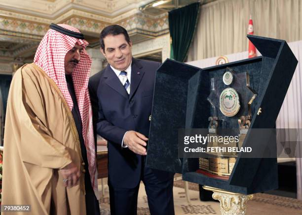 Tunisian president Zine El-Abidine Ben Ali recieves the Logo of the "Arab Interior Minister" from Saudi Interior Minister Prince Nayef bin Abdul Aziz...