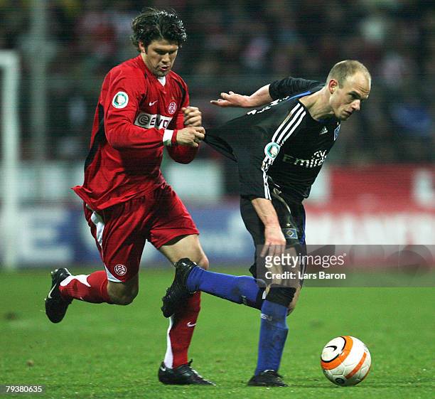 Mario Klinger of Essen holds David Jarolim of Hamburg during the DFB Cup Round of 16 match between Rot-Weiss Essen and Hamburger SV at...