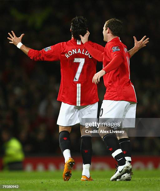 Cristiano Ronaldo of Manchester United is congratulated by team mate Wayne Rooney after scoring his team's second goal during the Barclays Premier...