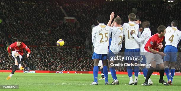 Cristiano Ronaldo of Manchester United scores his team's second goal during the Barclays FA Premier League match between Manchester United and...