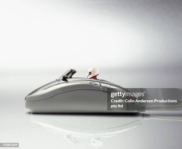 digital composite of race car driver in computer mouse - super slow motion stock pictures, royalty-free photos & images