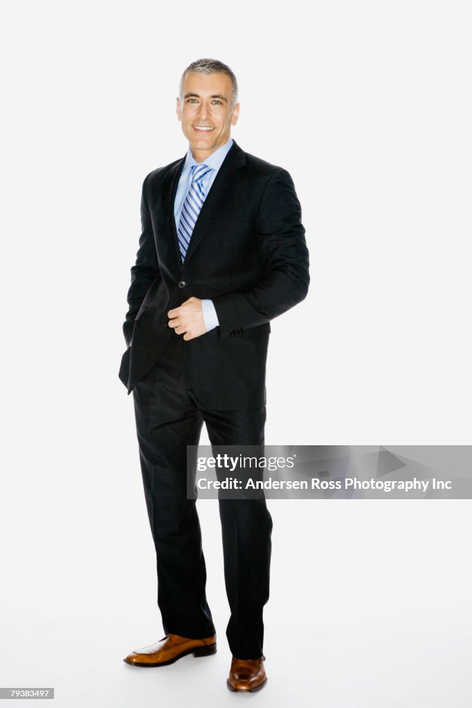 Middle Eastern businessman with hand on jacket button