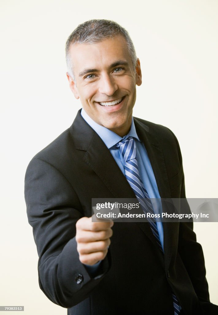 Middle Eastern businessman offering business card