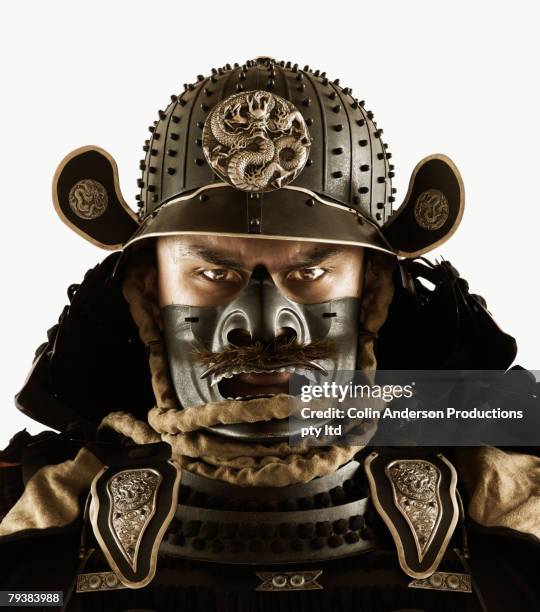close up of asian man in samurai armor - samurai stock pictures, royalty-free photos & images