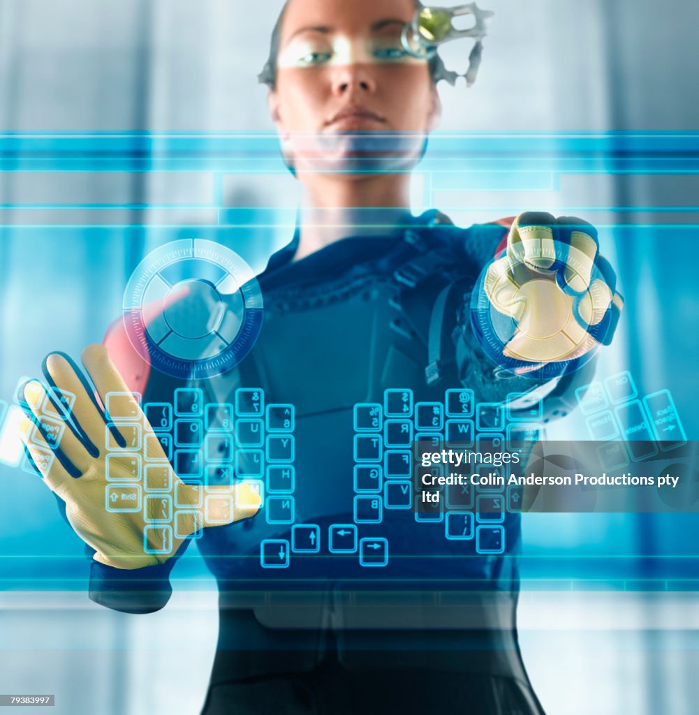 Digital composite of woman using futuristic touch screen