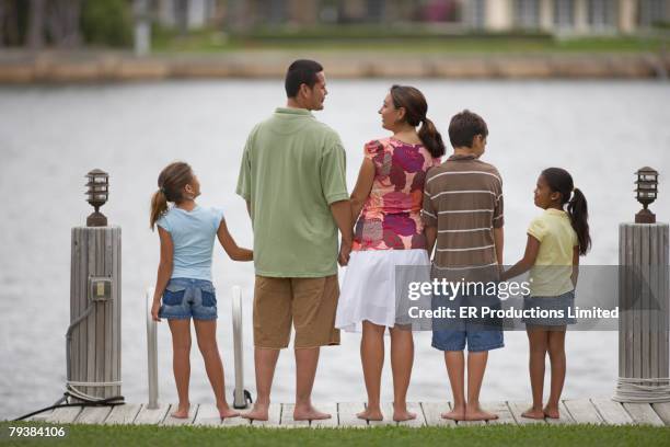 rear view of multi-ethnic family - adopción fotografías e imágenes de stock