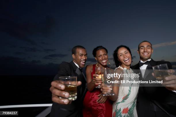 multi-ethnic couples toasting - tuxedo party stock pictures, royalty-free photos & images