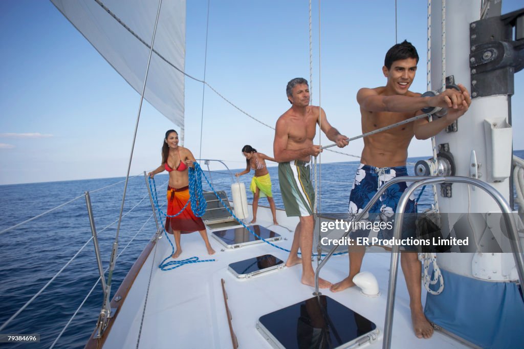 Friends Rope Pull Multiethnic Friends Pulling Rope On Sailboat High-Res Stock Photo ...