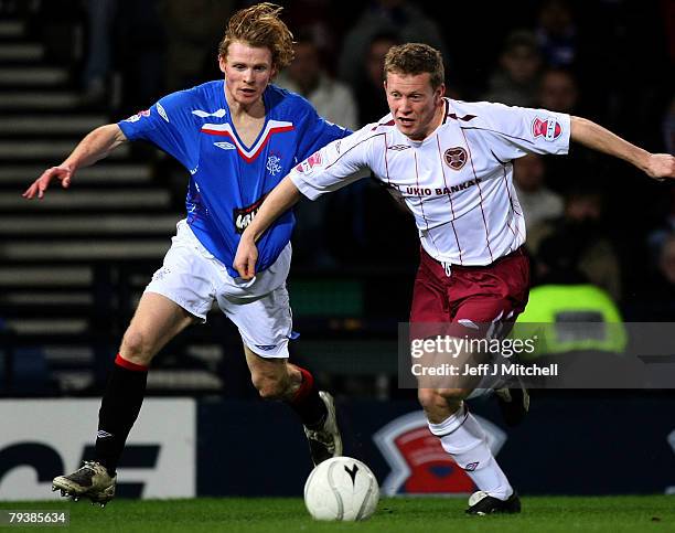 Chris Burke of Rangers tackles Michael Stewart of Hearts during the CIS Insurance Cup semi final between Rangers and Hearts at Hampden Park on...