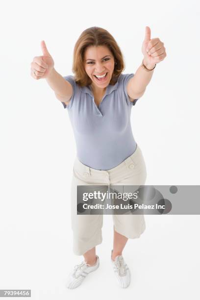 african american woman giving thumbs up - black thumbs up white background stock-fotos und bilder