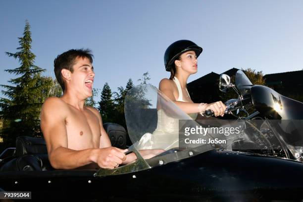 hispanic couple on motorcycle with sidecar - motorcycle side car stock pictures, royalty-free photos & images
