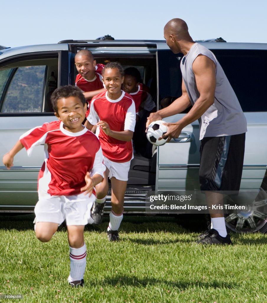 Multi-ethnic children in soccer uniforms