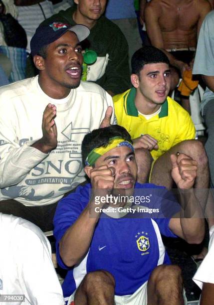 Brazilian fans react as they watch the Brazilian national soccer team play against England in the Federation Internationale de Football Association...