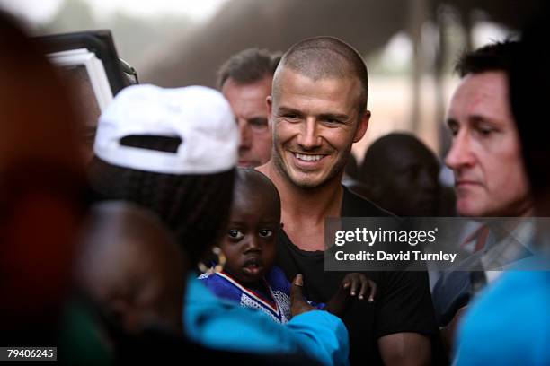 Goodwill Ambassador David Beckham meets fans and players after a game of football with a group of boys during his first field visit with UNICEF to...