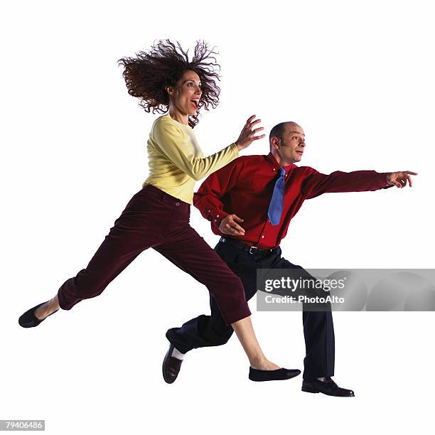 man and woman jumping - necktie run stockfoto's en -beelden