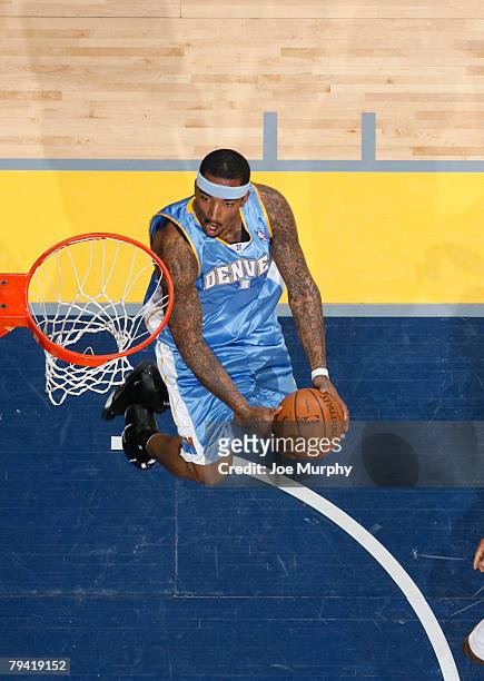 Smith of the Denver Nuggets tries for a reverse dunk in a game against the Memphis Grizzlies on January 30, 2008 at the FedExForum in Memphis,...