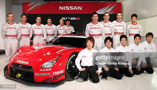 Nissan's drivers pose in front of Nissan's No.23 Xanavi Nismo GT-R during the Nissan 2008 Motorsports Activities press conference at Nissan...