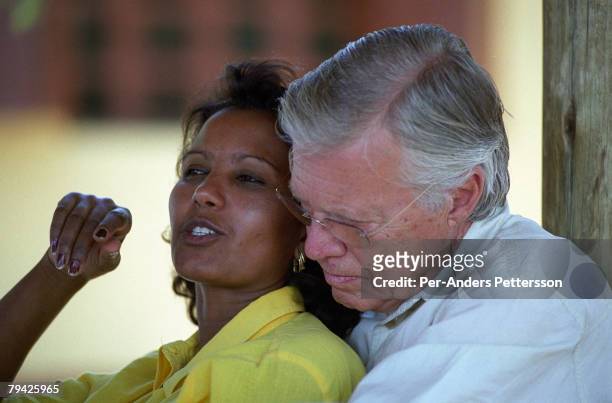 Austrian actor KarlHeinz Bohm shares a private moment with his wife as they visit an opening of a water project for several villages in a rural area...