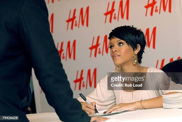 Singer Rihanna signs autographs at H&M for the launch of Fashion Against AIDS Collection on January 31, 2008 in New York City.