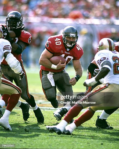 Tampa Bay Buccaneers fullback Mike Alstott carries the football during the Buccaneers 31-6 victory over the San Francisco 49ers in the 2002 NFC...