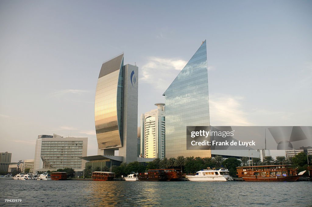 Dhows and yachts docked in front of National Bank of Dubai at Dubai Creek. Dubai Creek, Dubai, United Arab Emirates