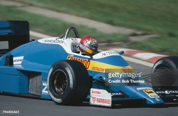 Italian racing driver Alex Caffi drives the Osella Squadra Corse Osella FA11 Alfa Romeo V8 in the 1987 Belgian Grand Prix at Circuit de...