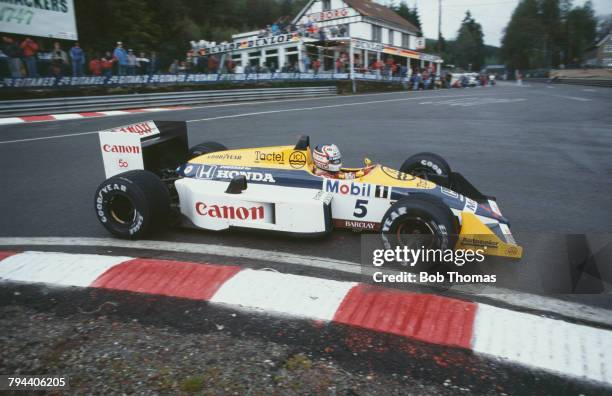 British racing driver Nigel Mansell drives the Canon Williams Honda Williams FW11B Honda RA167E 1.5 V6t in the 1987 Belgian Grand Prix at the Circuit...