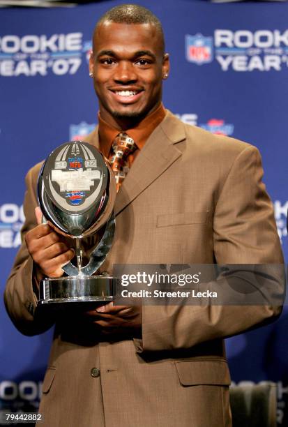 Running back Adrian Peterson of the Minnesota Vikings accepts the 2007 Diet Pepsi NFL Rookie of the Year Award at a news conference prior to Super...