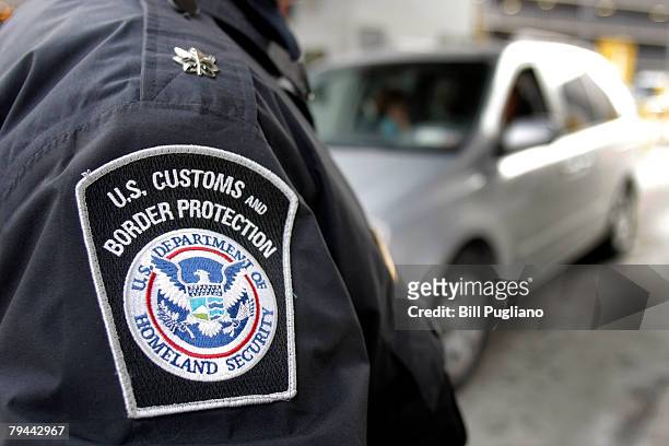 Customs & Border Protection agent stands at the Detroit/Windsor Tunnel January 31, 2008 in Detroit, Michigan. Today is the first day that new rules...