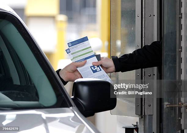 Driver receives information on the new rules for identification that went into effect today at U.S. Borders from a U.S. Customs & Border Protection...