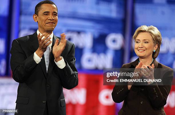 Democratic presidential candidates, Illinois Senator Barack Obama and New York Senator Hillary Clinton arrive on stage for the Democratic...