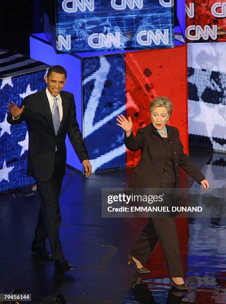 Democratic presidential candidates, Illinois Senator Barack Obama and New York Senator Hillary Clinton arrive on stage for the televised CNN/LA...