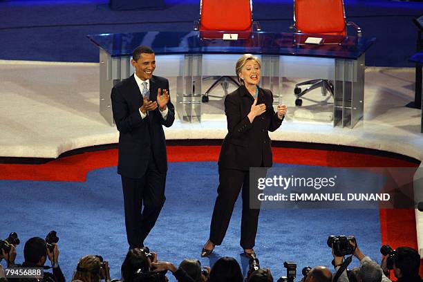 Democratic presidential candidates, Illinois Senator Barack Obama and New York Senator Hillary Clinton arrive on stage for the televised CNN/LA...