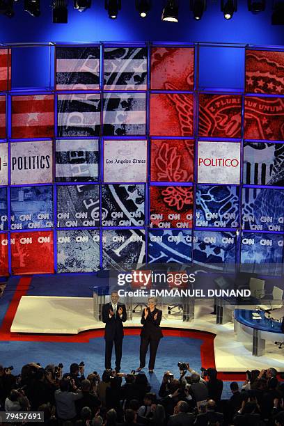 Democratic presidential candidates, Illinois Senator Barack Obama and New York Senator Hillary Clinton arrive on stage for the televised CNN/LA...