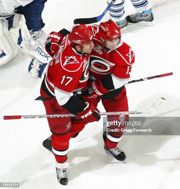 Rod Brind Amour of the Carolina Hurricanes is congratulated by teammate Ray Whitney after scoring the game-winner in overtime to defeat the Toronto...