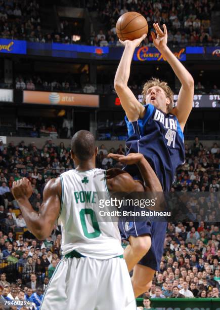 Dirk Nowitzki of the Dallas Mavericks takes a shot against Leon Powe of the Boston Celtics on January 31, 2008 at the TD Banknorth Garden in Boston,...