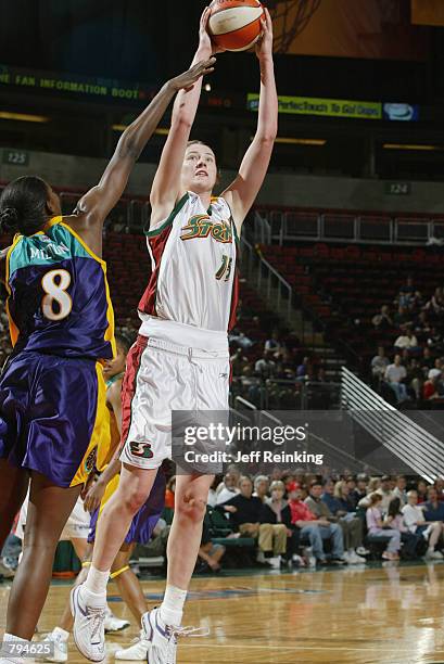 Lauren Jackson of the Seattle Storm shoots over DeLisha Milton of the Los Angeles Sparks during the game on June 18, 2002 at Key Arena in Seattle,...