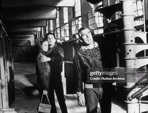Canadian actors Sharon Acker and John Vernon with American actor Lee Marvin in a scene from the thriller 'Point Blank', directed by John Boorman,...
