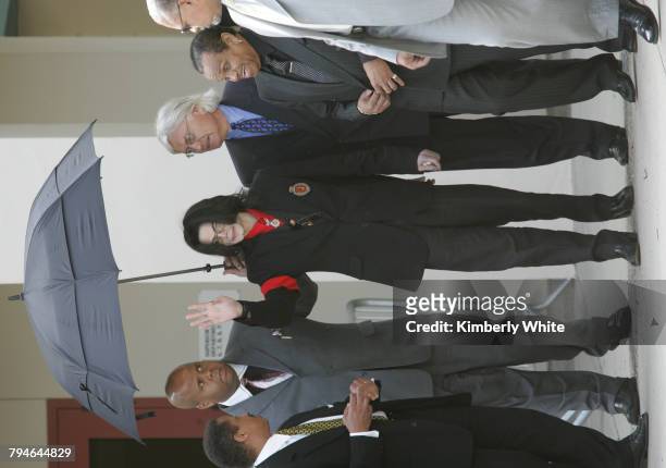 Pop star Michael Jackson waves to fans alongside his father Joe and lead attorney Thomas Mesereau Jr. , on leaving the Santa Barbara County Superior...