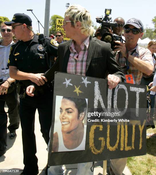 Irish Sean O'Kane , a supporter of pop singer Michael Jackson, is briefly taken away by police for creating a disturbance at the Santa Barbara County...